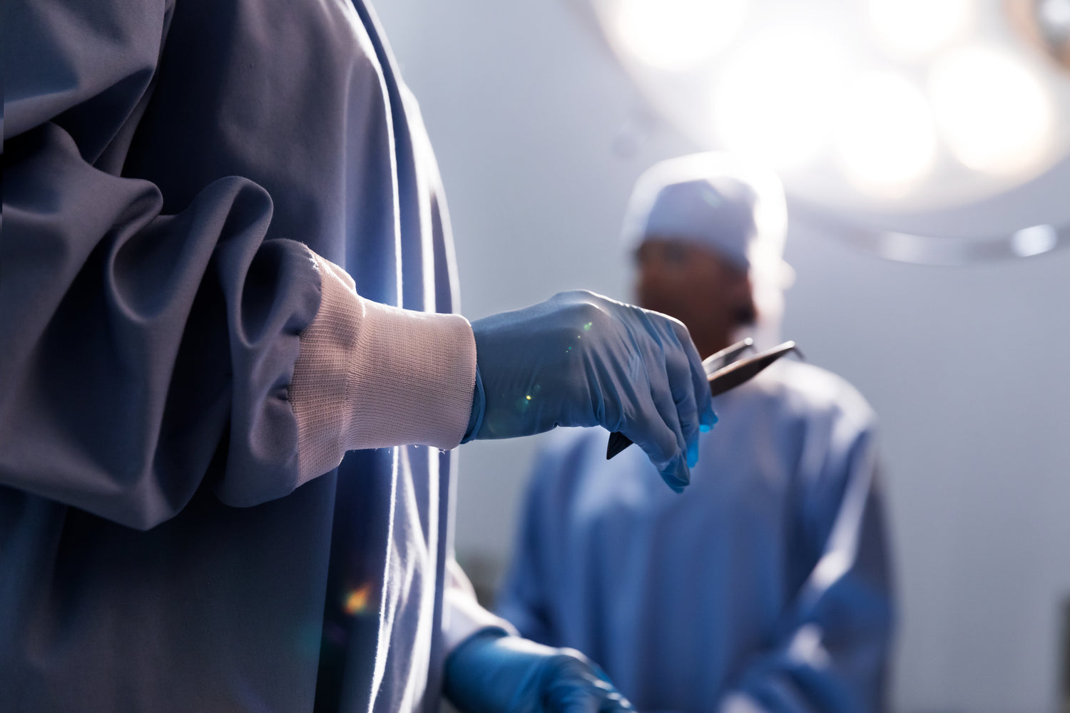 Doctor holding tweezers