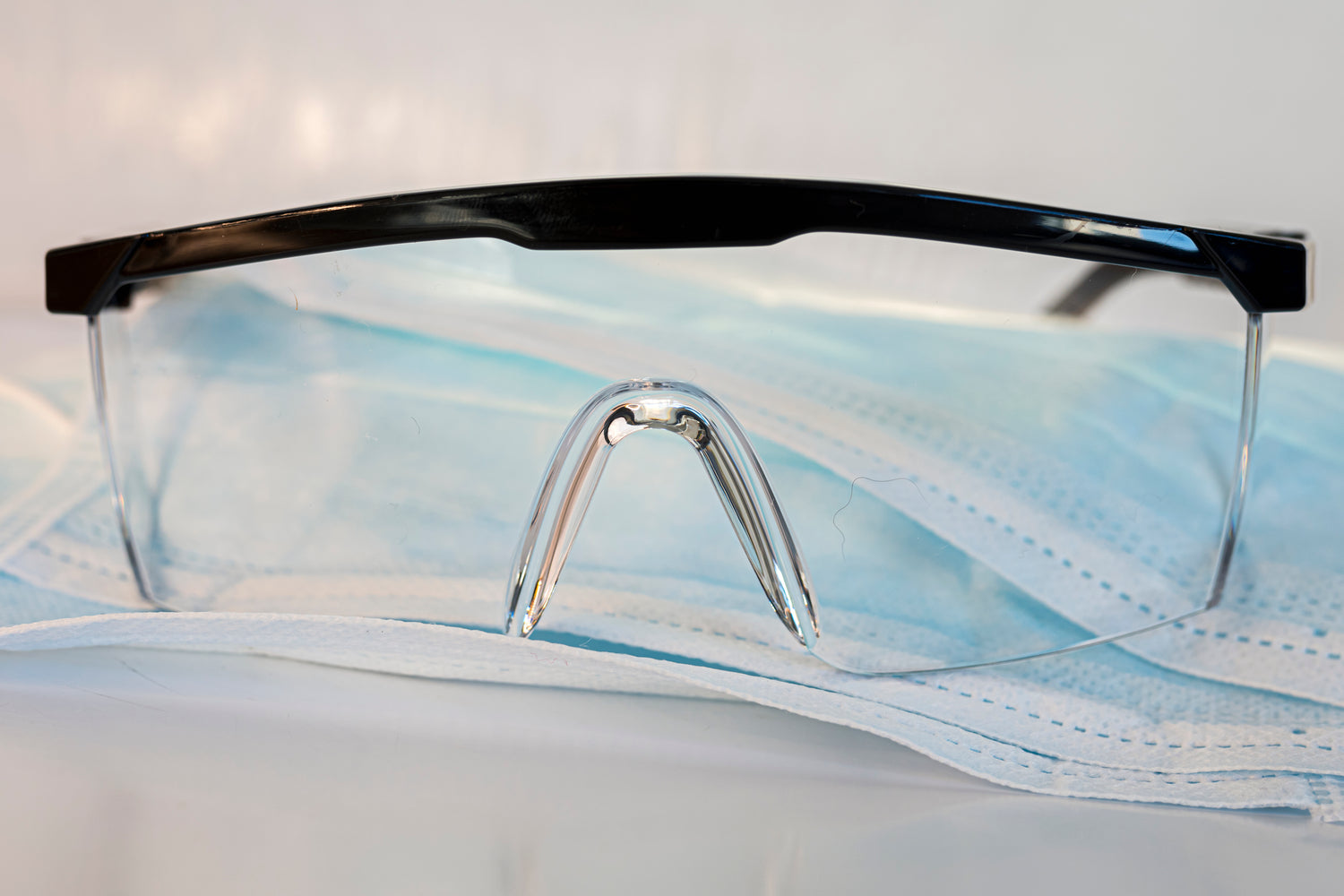 Protective face mask and clear glasses